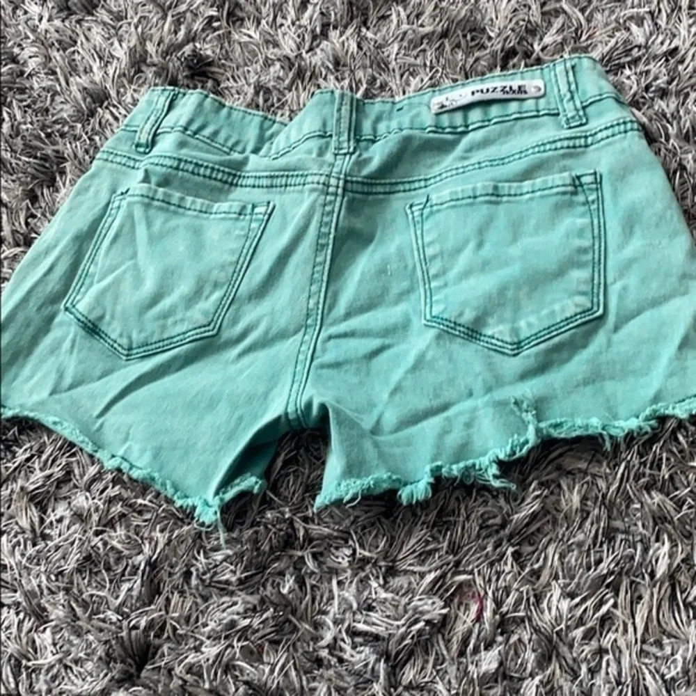 Distressed green denim shorts Puzzle size 3.